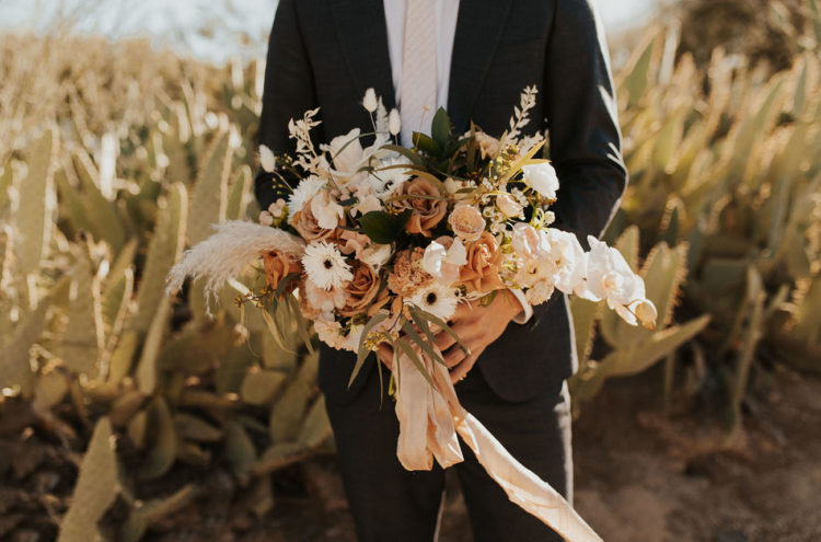 The wedding bouquet was done in rust and peachy shades, with pampas grass and lots of various blooms