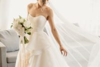 04 an elegant wedding ballgown with a sweetheart neckline and ruffles on the skirt plus a train