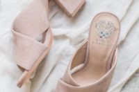 04 blush mules are a trendy statement that can finish off a tender and romantic bridal look and add an edgy feel
