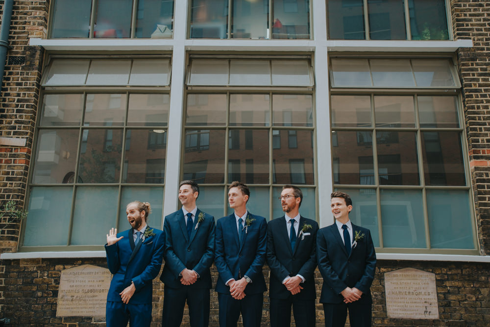 The groomsmen were rocking navy suits and blue ties, too
