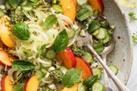 05 late summer salad with crisp fennel, juicy peaches, creamy pesto, basil and cucumbers is a refreshing and not hearty dish
