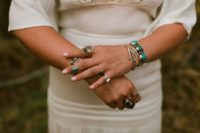 a bride wearing lots of cool hand accessories