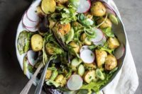 06 a potato salad with radish, spring onions, various kinds of greenery and mustard dressing is a more nutricious salad idea