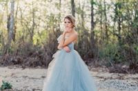 06 a strapless blue wedding ballgown with a draped bodice and a layered skirt with a train for your ‘something blue’