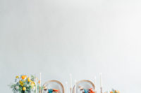 07 The wedding reception was done with a wooden table, a floral table runner, a lush and bright floral centerpiece
