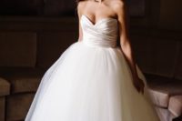 07 an elegant strapless wedding ballgown with a sweetheart neckline, a full tulle skirt and a draped bodice
