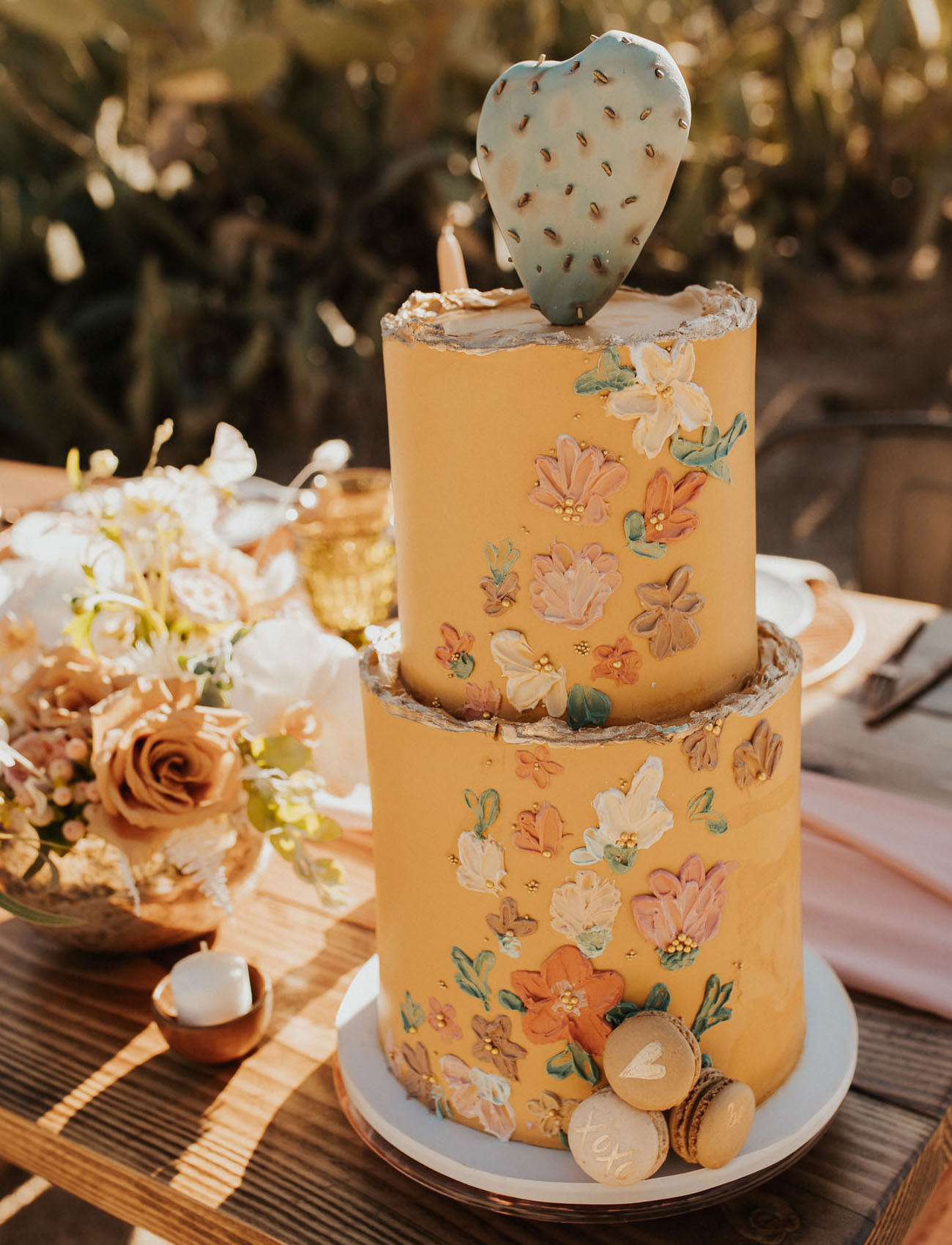 The wedding cake was a yellow one, with painted flowers and a cactus on top
