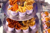 09 a French fry stand with fries in paper cones – add ketchup, dressings, sauces and maybe veggies