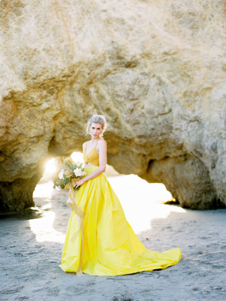a mustard crop top and a sunny yellow full skirt with a train for a color-inspired and trendy bridal look