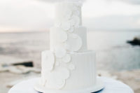 10 The wedding cake was done in white, with white bubble decor