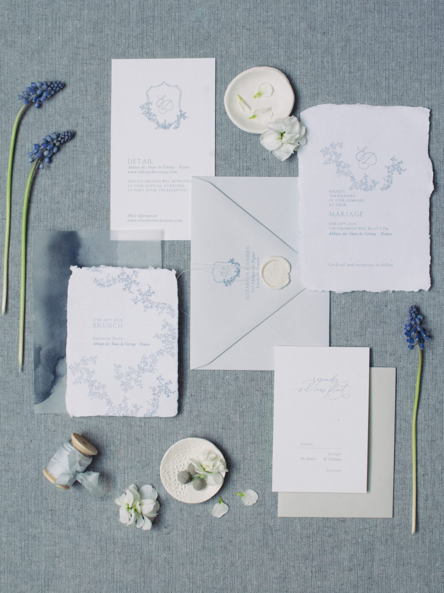 The paper goods were styled with a raw hem and blue floral patterns