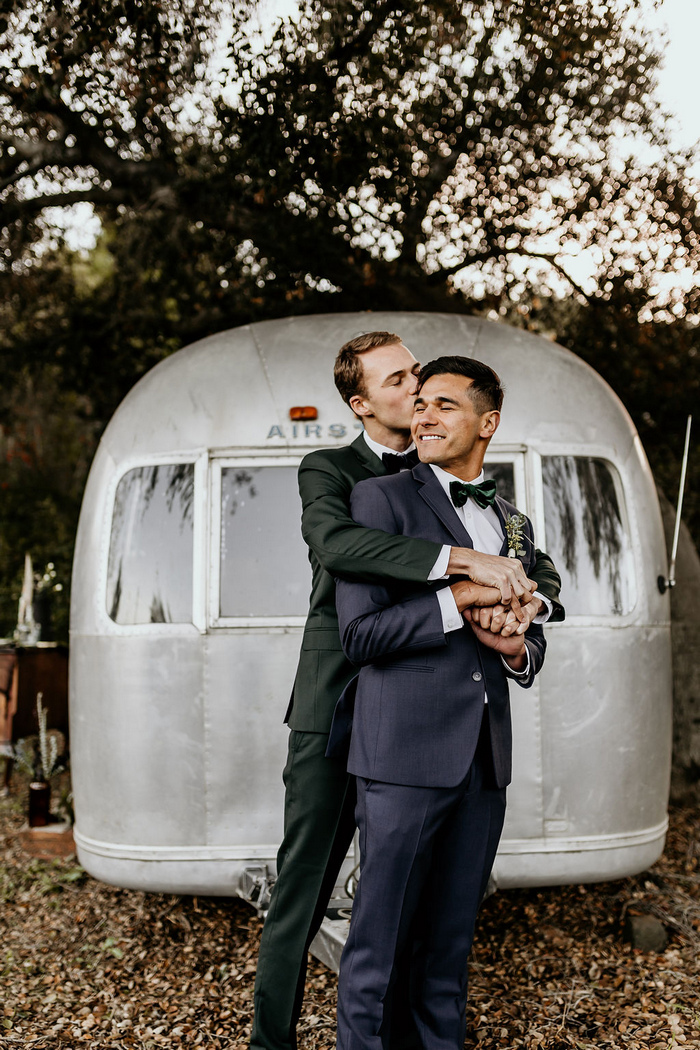 What a chic and cute couple and a cool retro 1968 Airstream behind