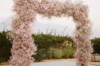 12 a beautiful blush cherry blossom wedding arch is a gorgeous spring idea to try