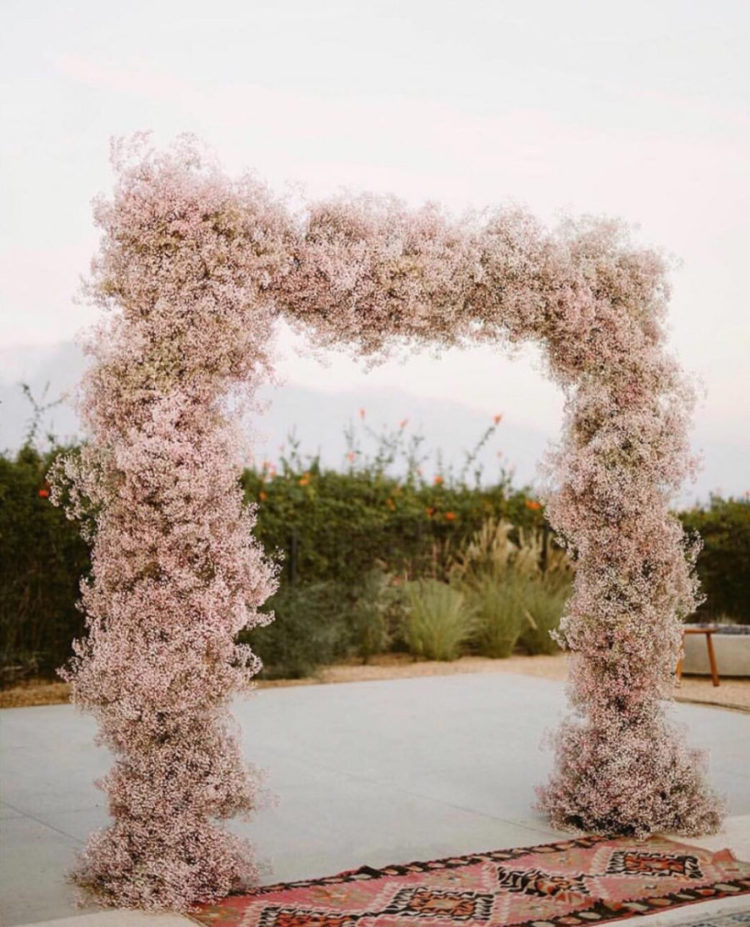 a beautiful blush cherry blossom wedding arch is a gorgeous spring idea to try