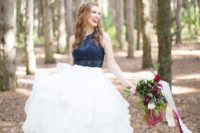 12 a chic wedding outfit with a navy lace halter neckline top and a ruffle full skirt