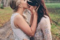 12 one bride kissing the other on the forehead to blessit’s a very touching moment