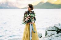 13 a daring bridal separate with a black lace top with long sleeves and a sunny yellow maxi skirt with pleating