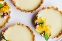 14 gorgeous vegan lemon tarts are no bake and ultra tangy, topped with fresh flowers and lemon zest
