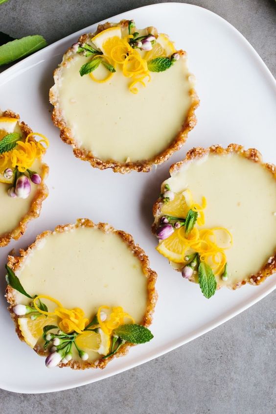 gorgeous vegan lemon tarts are no bake and ultra tangy, topped with fresh flowers and lemon zest
