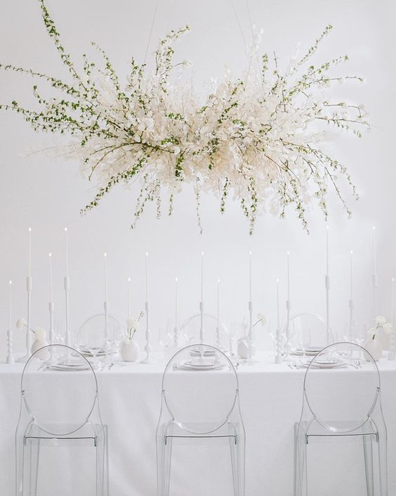 a fantastic overhead lunaria and greenery wedding installation will highlight your reception