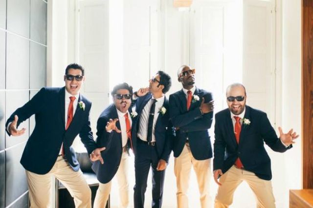groomsmen having fun before the cermeony with the groom is a very cute and fun wedding pic idea