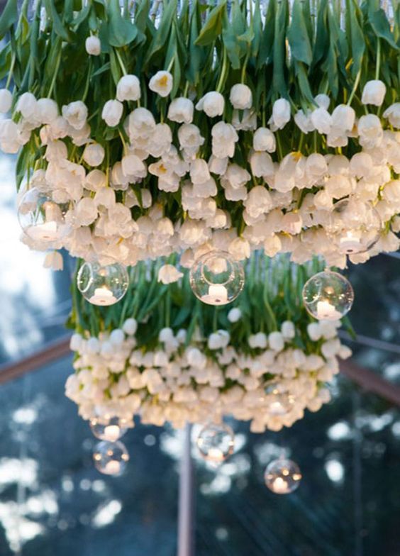 a fantastic white tulip chandelier with hanging candle holders just scream spring