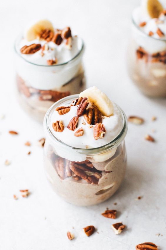 creamy vegan banana pudding with roasted pecans, chia seeds, cashews and coconut