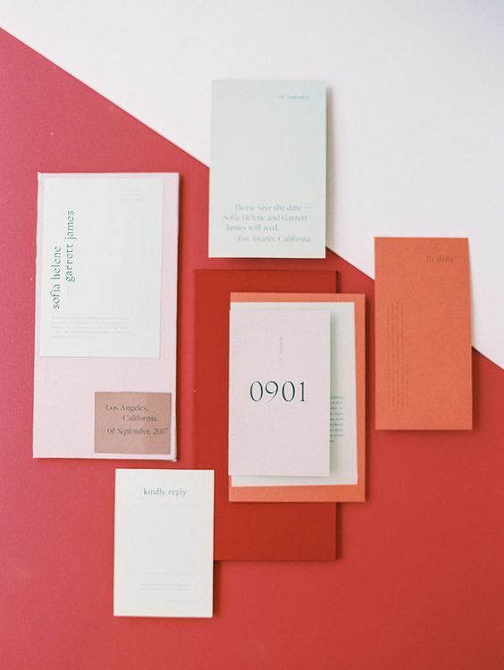 a modern color block wedding invitation suite done in blush, mint, orange and red for a bold look