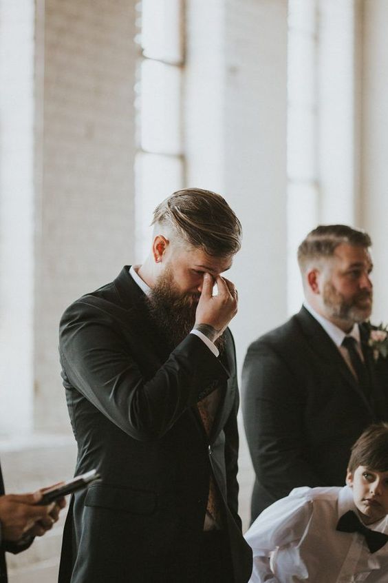 the groom crying while his bride is going down the aisle is a very touching moment of the ceremony