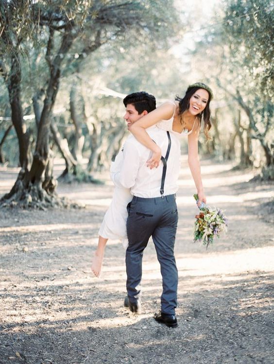 a groom kidnapping his bride is a fun wedding photo idea with a touch of intimacy