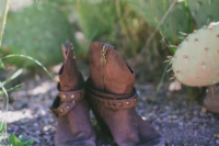 19 brown studded cowboy boots are a nice idea for a desert wedding to keep your feet safe