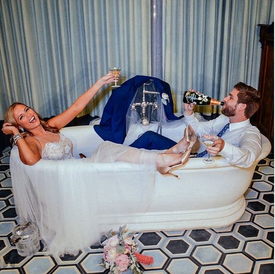 get into a bathtub together and have some drinks to get amazingly fun and excitign wedding pics