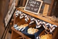 21 a small popcorn bar with chevron covered baskets is a cool idea of a late night snack