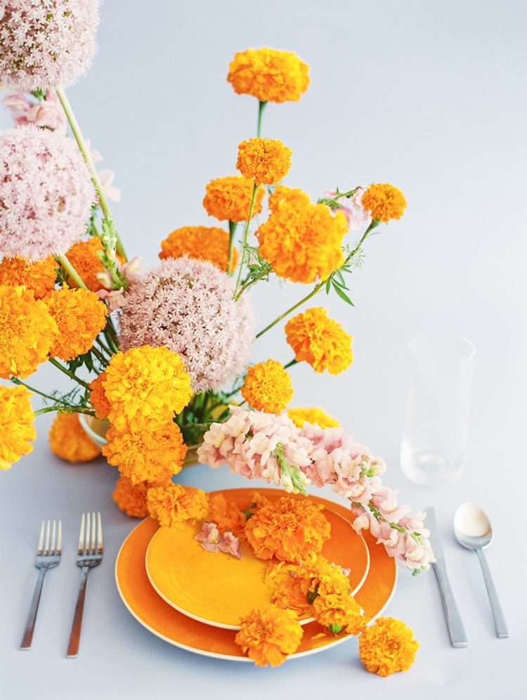 marigold and soft pink against a pale blue background is an icredible combo for a color-loving couple