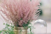 23 a simple wedding bouquet of a gold jar with pink flowers is a chic and bold decor idea