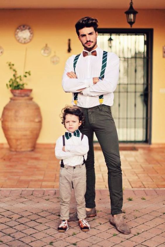 grey chinos, a white shirt,a  burgundy bow tie, striped green suspenders and grey suede loafers