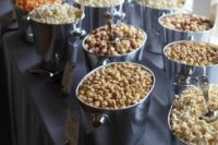 24 an elegant popcorn bar with silver tubs and labels is a fit for any wedding, the tubs are very elegant