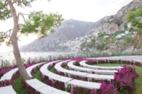 27 a wedding ceremony space done with purple blooms even under the benches is a gorgeous modern idea