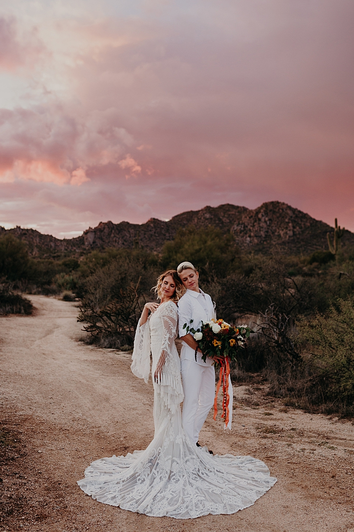 This boho desert elopement shoot took place in Arizona desert and featured an amazing bright sky
