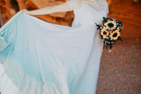 02 The bride was wearing an ombre white to turquoise wedding dress with a lace coverup, a teal headpiece