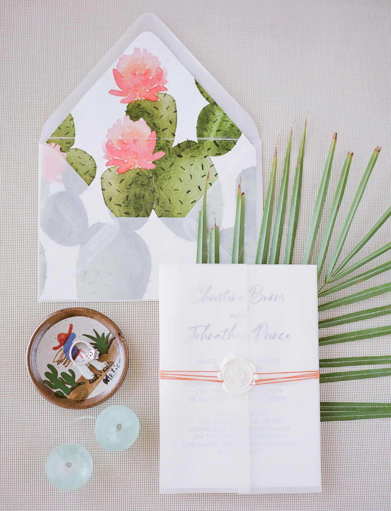 The wedding stationery suite was done with cacti and colorful yarn to embrace the destination