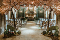 03 The wedding ceremony space was inspired by enchanted forests, with moss bunny and deer figurines, lots of blooms and lush greenery