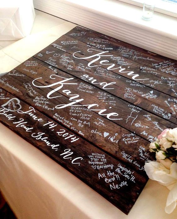 a reclaimed wooden sign with your names and lots of wishes from the guests to be used as an artwork