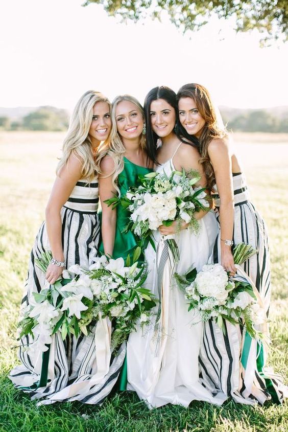 straped maxi gowns in black and white and an emerald one shoulder maxi dress for the maid of honor