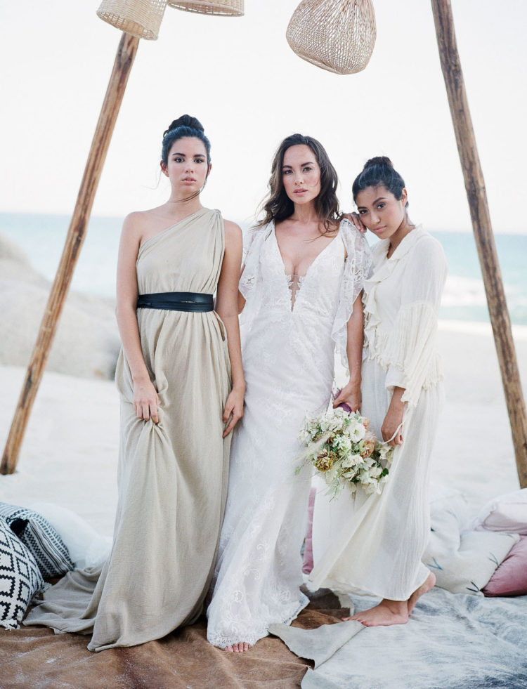 The bridesmaids were rocking mismatching neutral dresses and updos