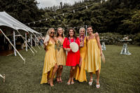 04 The bridesmaids were wearing mismatching yellow dresses and the maid of honor was rocking a red dress