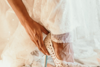 gorgeous laser cut shoes for a bride
