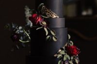 05 a matte black wedding cake with fresh and sugar blooms plus gold foil detailing