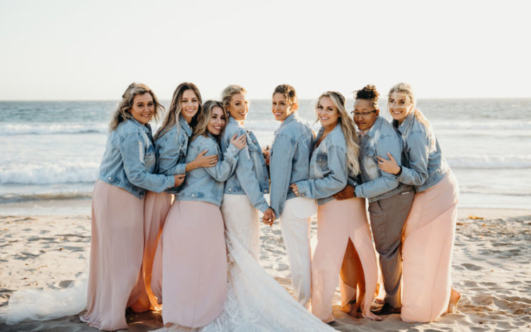 The bridesmaids were wearing blush maxi dresses with slits and denim jackets