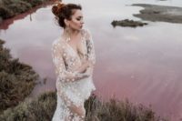 07 a celestial white sheer wedding dress with long sleeves and a train can be worn with some underwear or a bodysuit under